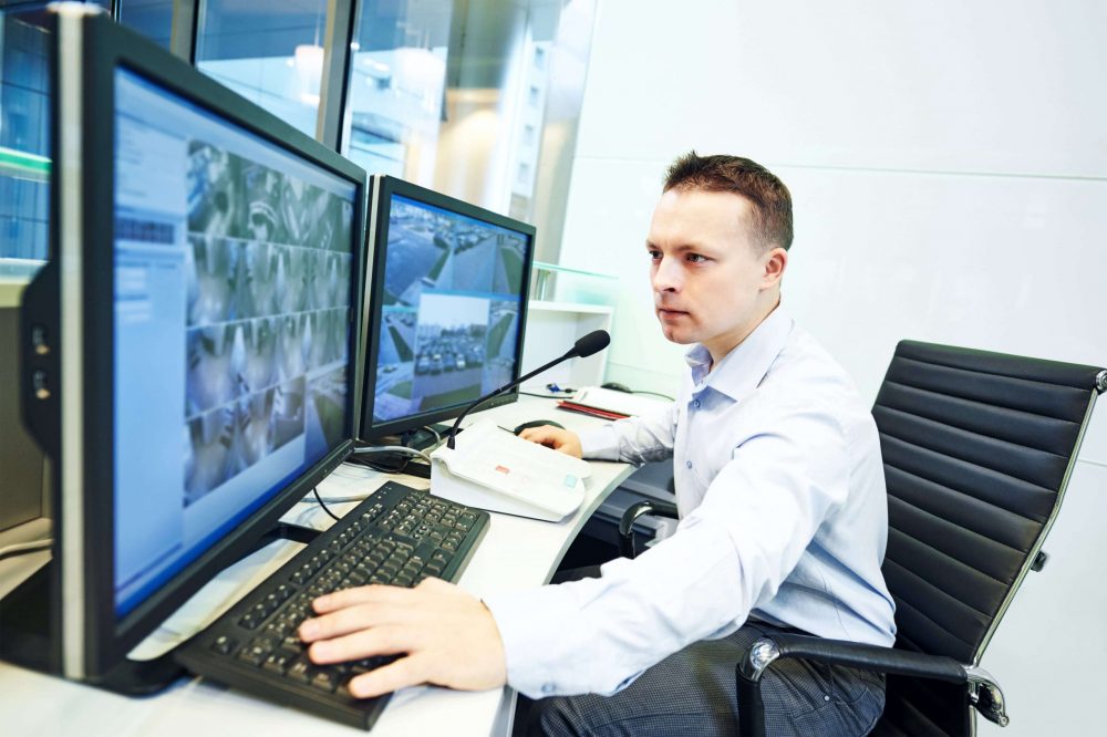 A security operative manning a CCTV monitoring system